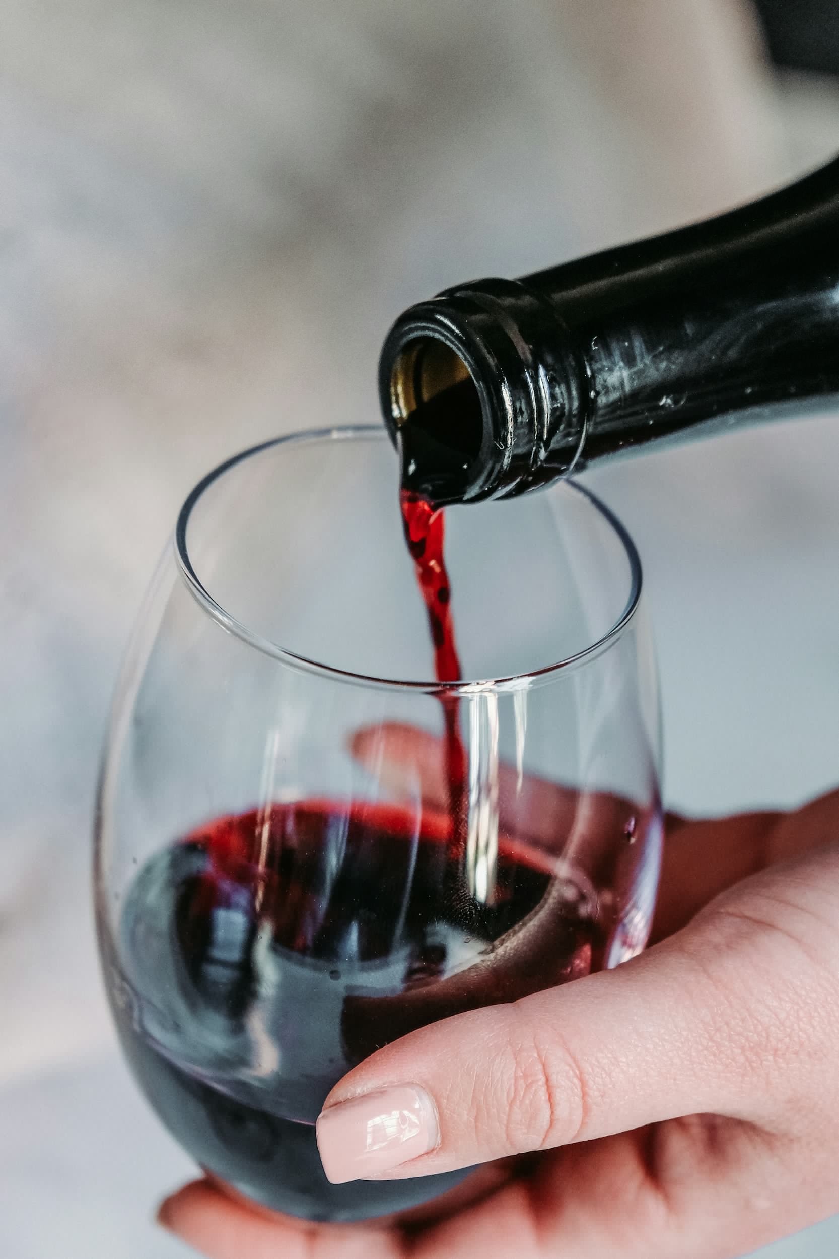 Red wine being poured into a glass
